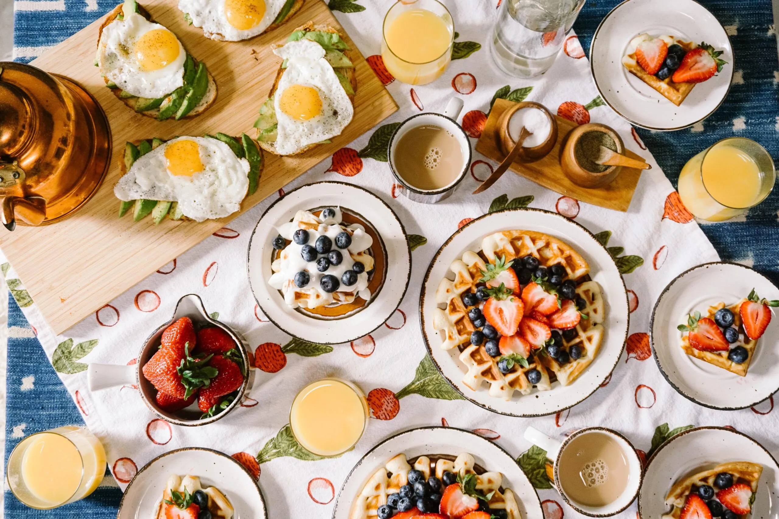 Breakfast food on plates with juice