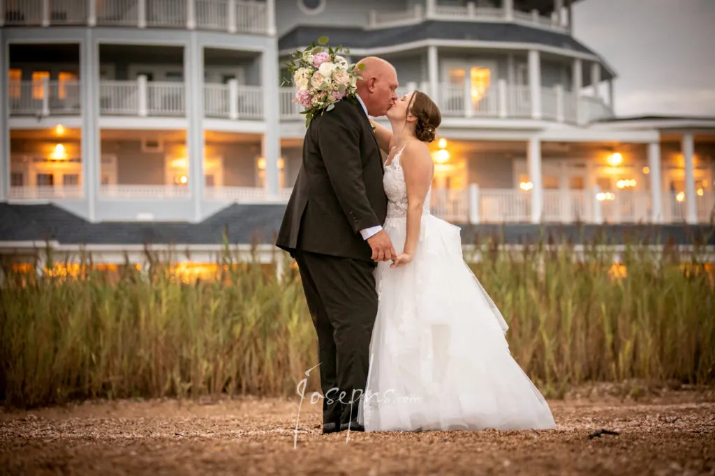 Couple kissing in front of the Madison Beach Hotel