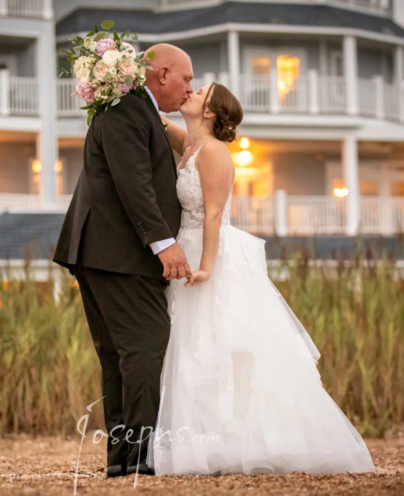 Couple kissing in front of the Madison Beach Hotel